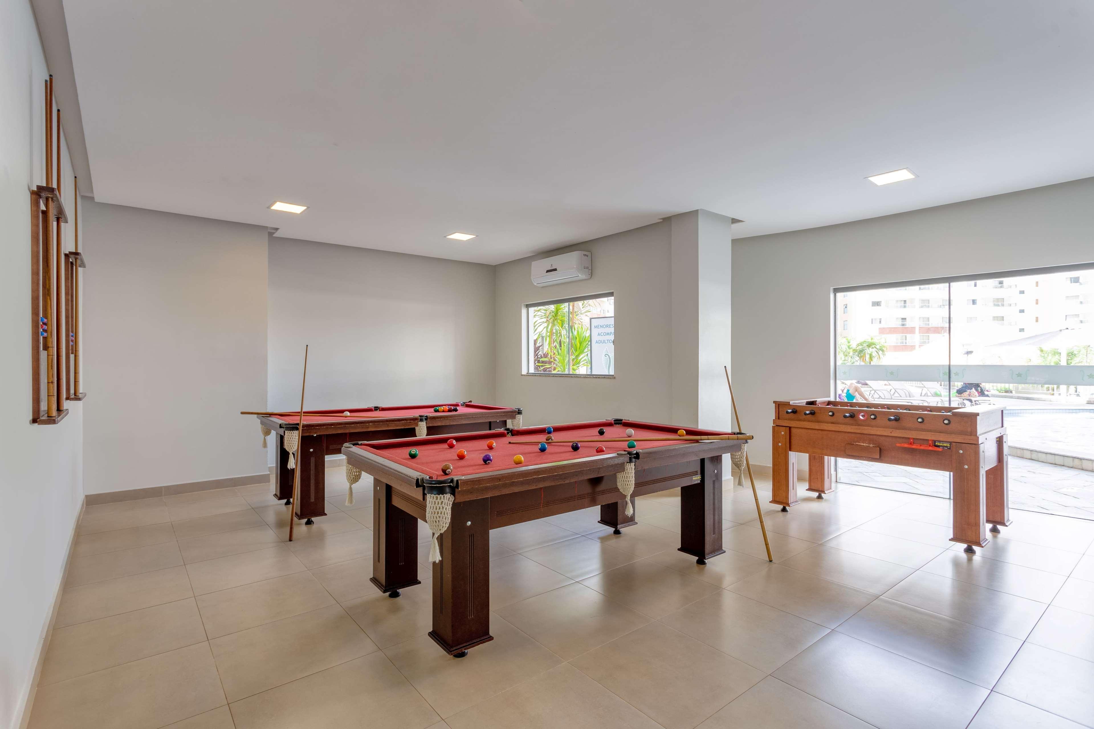 Wyndham Olimpia Royal Hotels Bagian luar foto A pool table and a foosball table